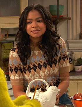 Nia's beige short sleeve argyle sweater on Ravens Home