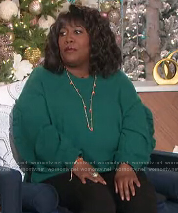 Sheryl's green ruffle trim sweater on The Talk