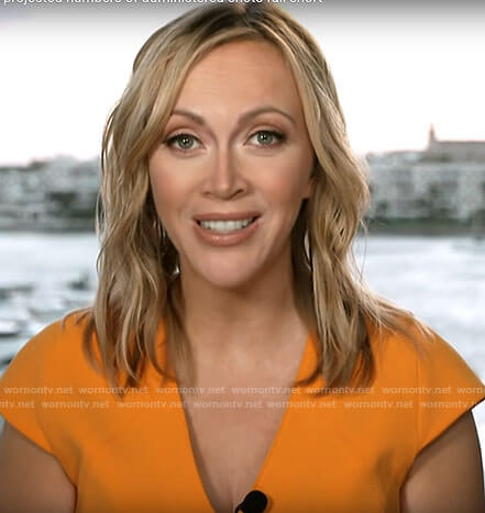 Paula Reid's orange v-neck dress on CBS This Morning