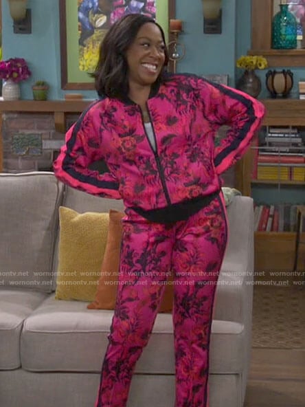Tina's pink floral track suit on The Neighborhood