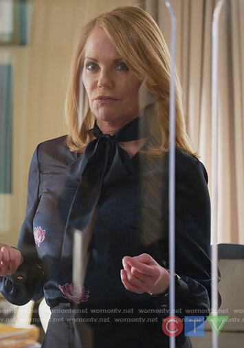 Lisa's navy floral tie neck blouse on All Rise