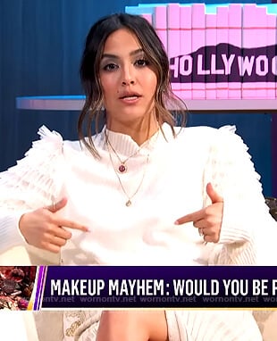 Erin's white ruffle sleeve sweater on E! News Nightly Pop
