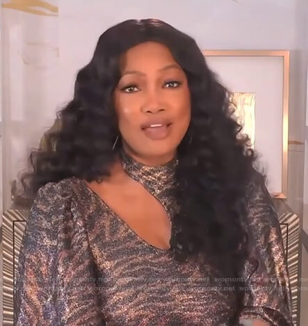 Garcelle's metallic tiger print top on The Real