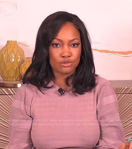 Garcelle's pink striped sleeve top on The Real