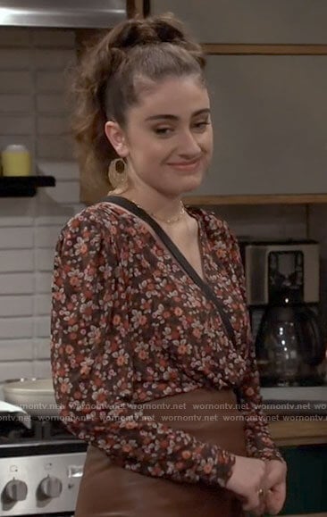 Jackie's floral blouse and leather skirt on Call Your Mother