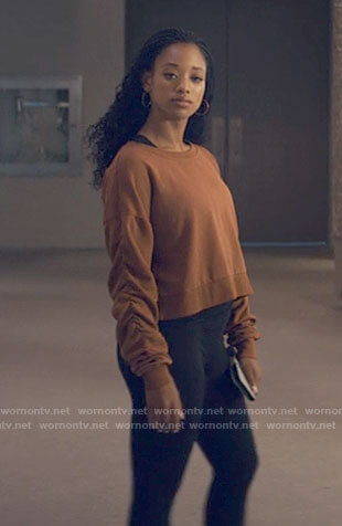 Neveah's rust orange sweatshirt with ruched sleeves on Tiny Pretty Things