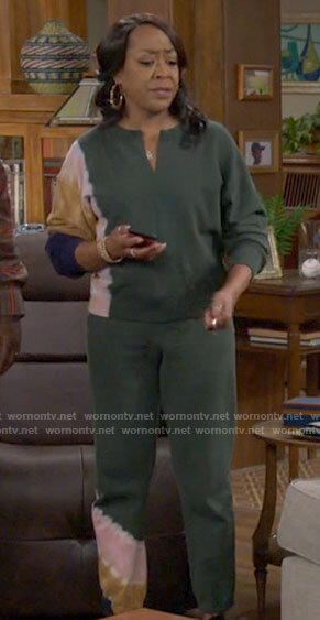 Tina's green tie dye sweatshirt and pants on The Neighborhood