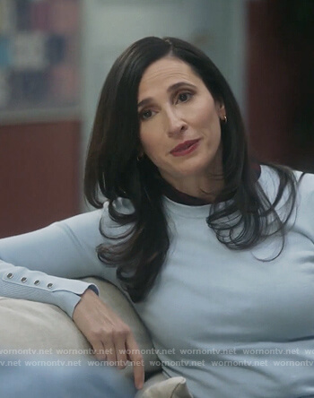 Delia's blue button cuff sweater on The Unicorn