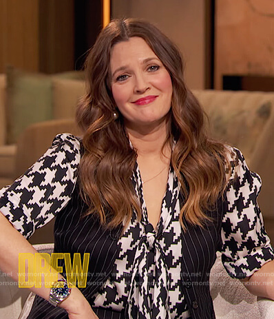 Drew's houndstooth print tie neck blouse on The Drew Barrymore Show