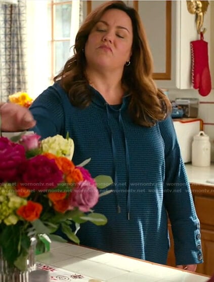 Katie's teal drawstring button cuff top on American Housewife