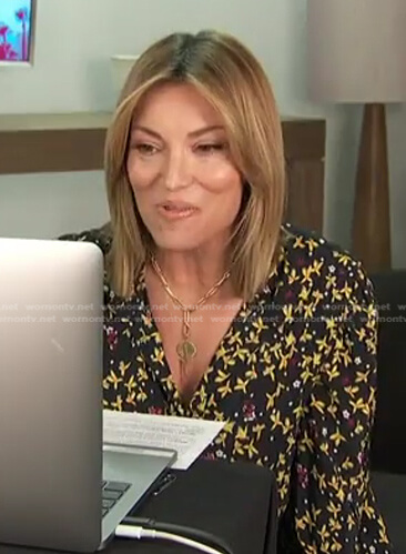 Kit's black and yellow floral blouse on Access Hollywood