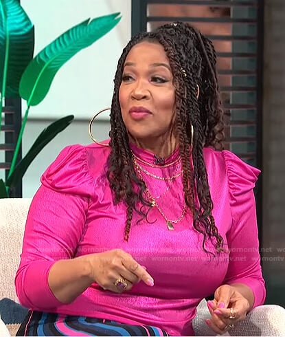 Kym's metallic puff sleeve top and striped skirt on E! News Daily Pop