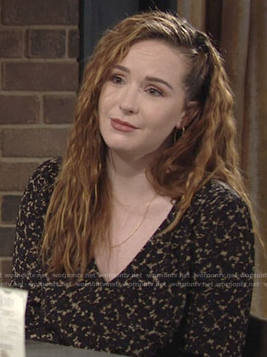 Mariah's black floral v-neck top on The Young and the Restless