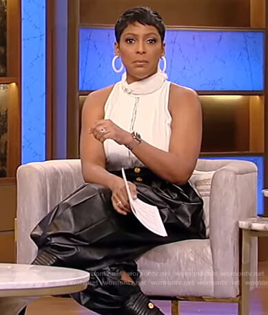 Tamron's white lace inset top and leather pants on Tamron Hall Show