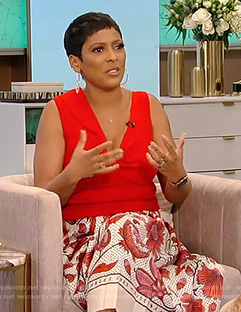 Tamron's red twist front top and printed floral skirt on Tamron Hall Show