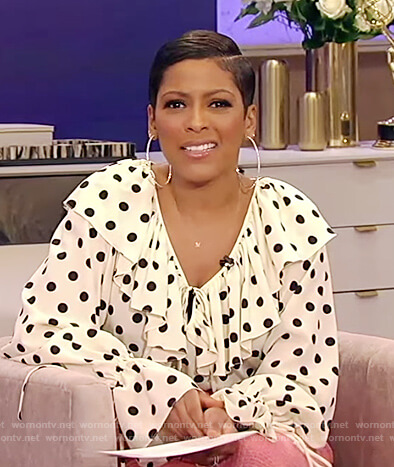 Tamron's white polka dot ruffle blouse on Tamron Hall Show
