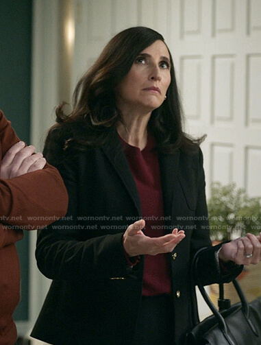 Delia's black pocket blazer on The Unicorn