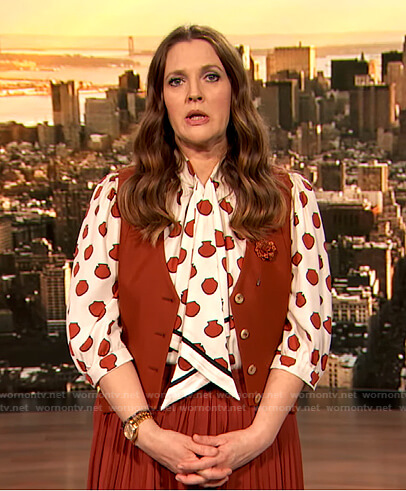 Drew's shell print tie neck blouse and vest on The Drew Barrymore Show