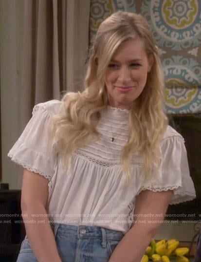 Gemma's white ruffled cotton top on The Neighborhood