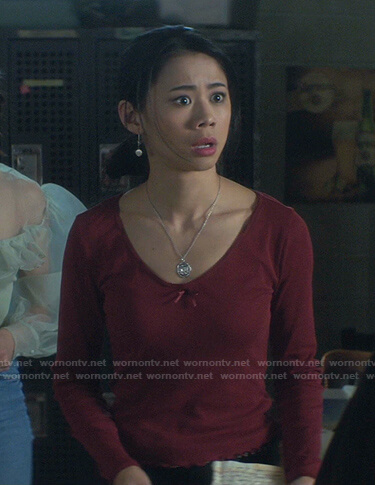 George's red scoop neck top on Nancy Drew