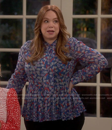 Kristin's blue floral tie neck blouse on Last Man Standing
