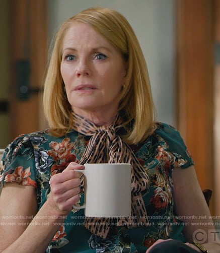 Lisa's green floral print tie neck blouse on All Rise