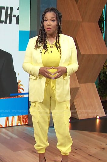 Kym's yellow cutout ribbed top and utility pants on E! News Daily Pop