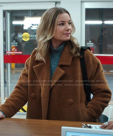 Nic's marled sweater and brown jacket on The Resident