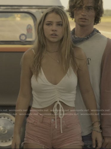 Sarah's white drawstring crop top and pink denim shorts on Outer Banks
