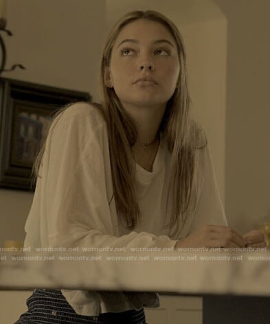 Sarah's white long sleeved tee and mini shorts on Outer Banks