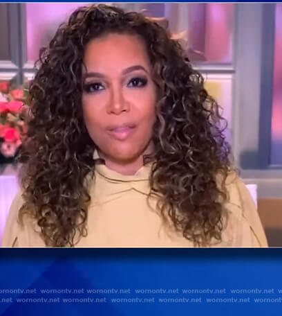 Sunny's yellow pleated blouse on The View