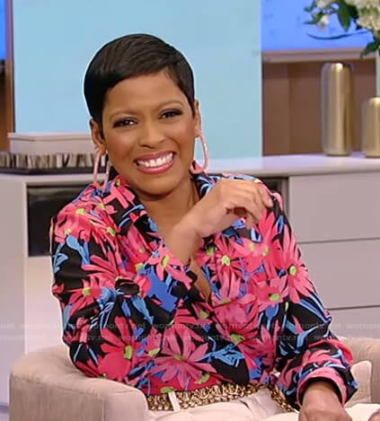 Tamron's floral blouse and white culotte pants on Tamron Hall Show
