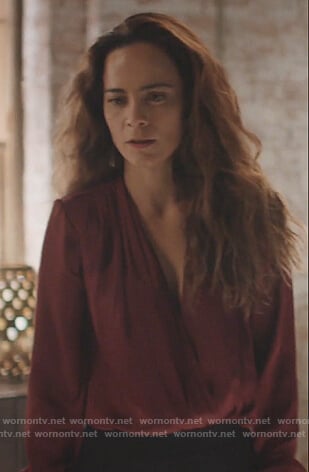 Teresa's burgundy satin bodysuit on Queen of the South