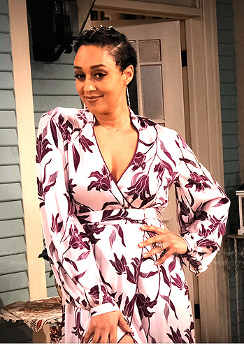 Cocoa's pink floral wrap dress on Family Reunion