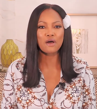 Garcelle's blue belt print blouse on The Real