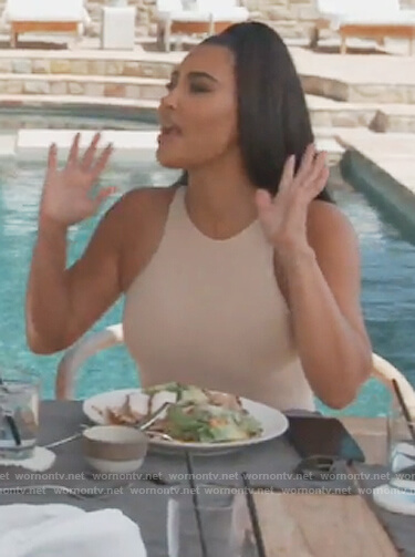 Kim's white sleeveless bodysuit on Keeping Up with the Kardashians