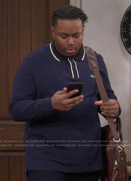 Marty's navy polo shirt with black collar on The Neighborhood