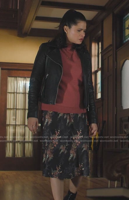Mel's pink sweater, leather jacket and floral skirt on Charmed