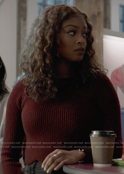 Ryan's burgundy scalloped sweater and floral embroidered jeans on Batwoman