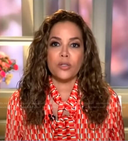 Sunny Hostin's red geometric tie neck blouse on Good Morning America