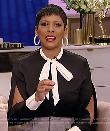 Tamron's black tie neck blouse with split sleeves on Tamron Hall Show