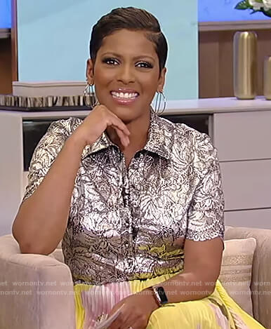 Tamron's metallic floral blouse and floral pleated skirt on Tamron Hall Show