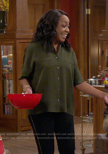 Tina's green button down blouse on The Neighborhood