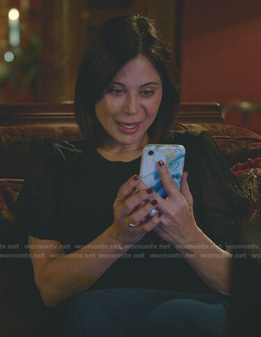 Cassie's black sheer puff sleeve top on Good Witch