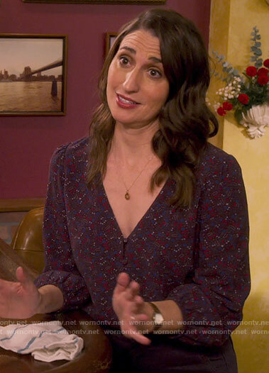 Dawn's purple floral v-neck top on Girls5eva