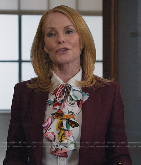 Lisa's white contrasting stitch blouse on All Rise