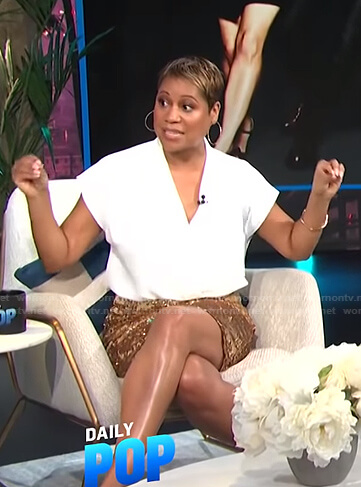 Monique's white top and gold sequin skirt on E! News Daily Pop