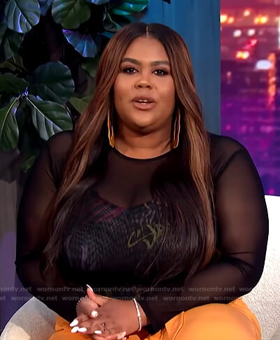 Nina's black graffiti print top on E! News Nightly Pop