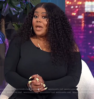 Nina's black off shoulder jumpsuit on E! News Nightly Pop