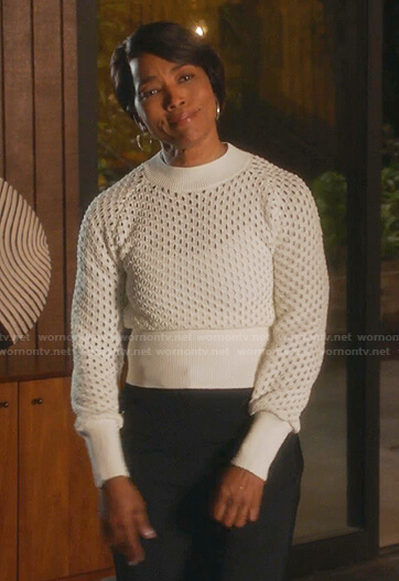 Athena's white open knit sweater on 9-1-1